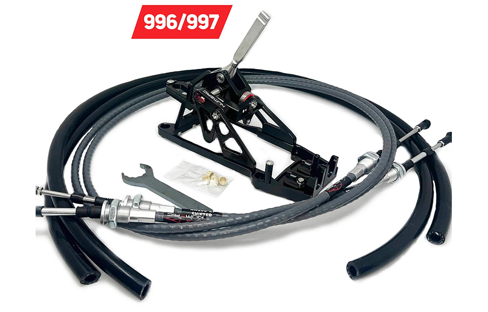 Numeric Racing short shifter assembly with hoses and wrench components on white background with 996 and 997 Porsche chassis codes.