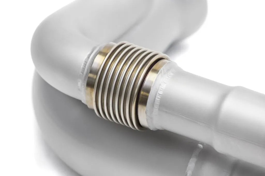 Close up of Pair of Soul Performance side muffler bypass exhaust pipe in silver for Porsche 911 GT3 on a white background.