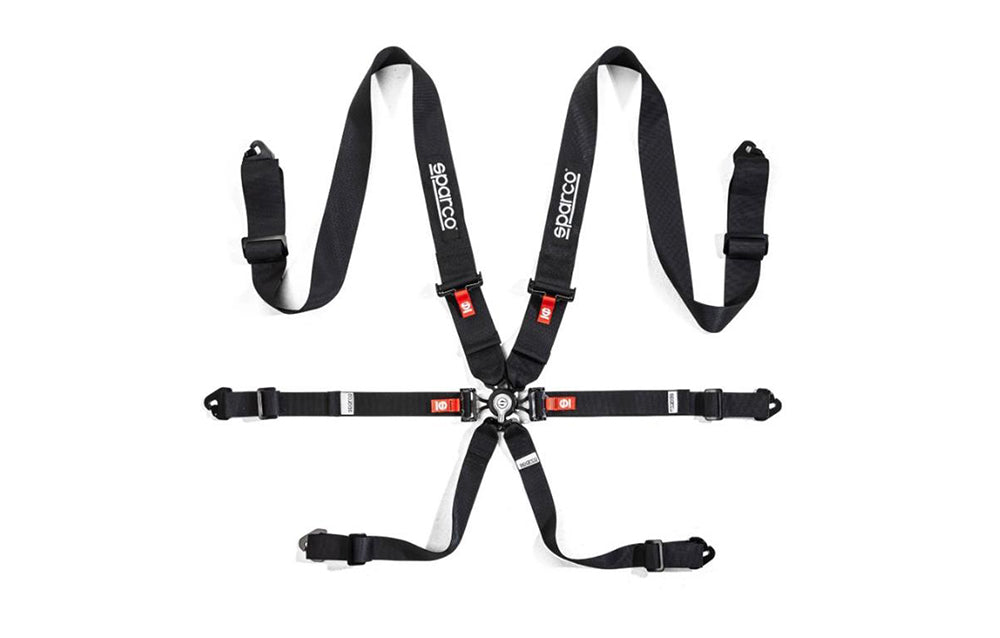 Sparco black 6-point harness with straps on a white background.