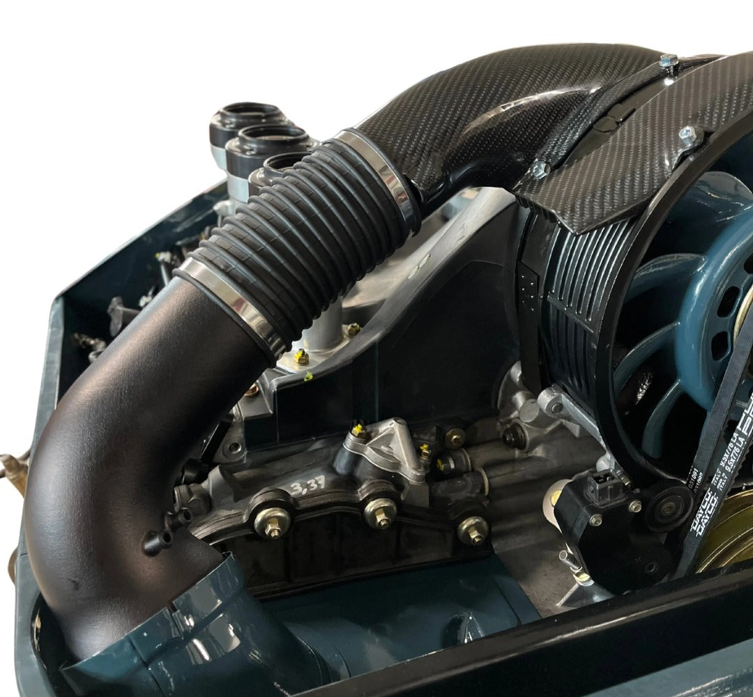Close-up of a Triebwerk fan heater for Porsche 964 RS heater duct upgrade with carbon fiber.
