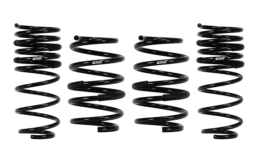 Four black Eibach pro-kit lowering springs on a white background.