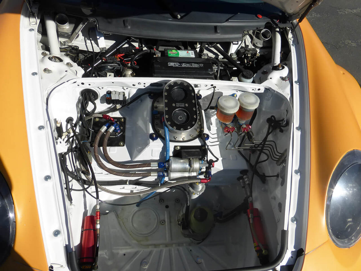 Open frunk of 911 GT3 revealing mechanical components.
