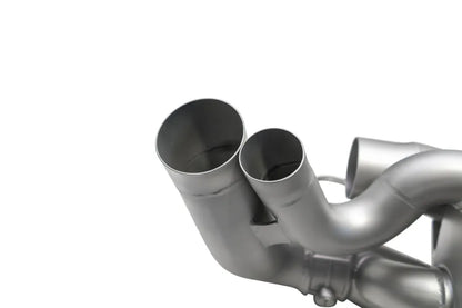 Close up of Soul Performance center muffler exhaust system pipes in silver for Porsche 911 on a white background.