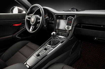 COBB Tuning Accessport installed inside of Porsche 911 991.2 black interior.