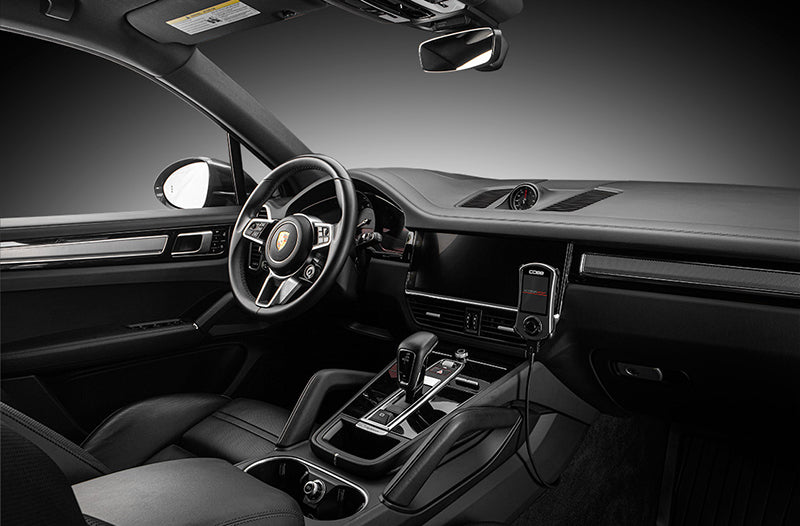 COBB Tuning Accessport installed inside Porsche Cayenne 9Y0 interior on right side dash.