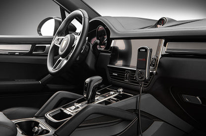 Close up of COBB Tuning Accessport installed inside Porsche Cayenne 9Y0 interior on right side dash.