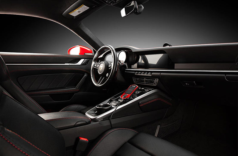 COBB Tuning Accessport installed inside a Porsche 992 Turbo black interior.