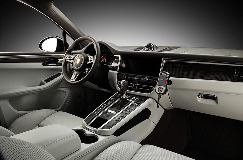 COBB Tuning Accessport installed inside Porsche Macan 95B interior.