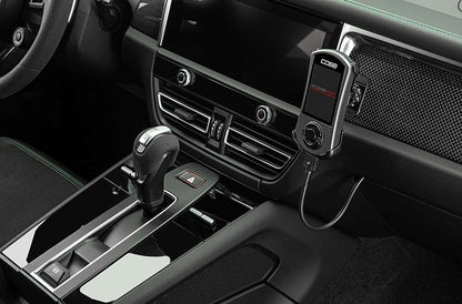 Close up of COBB Tuning Accessport installed inside Porsche Macan 95B.3 T interior.