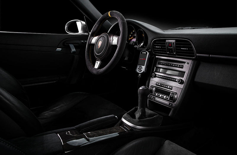 Cobb Tuning Accessport installed inside Porsche 997 Turbo interior.