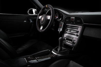 Cobb Tuning Accessport installed inside Porsche 997 Turbo interior.