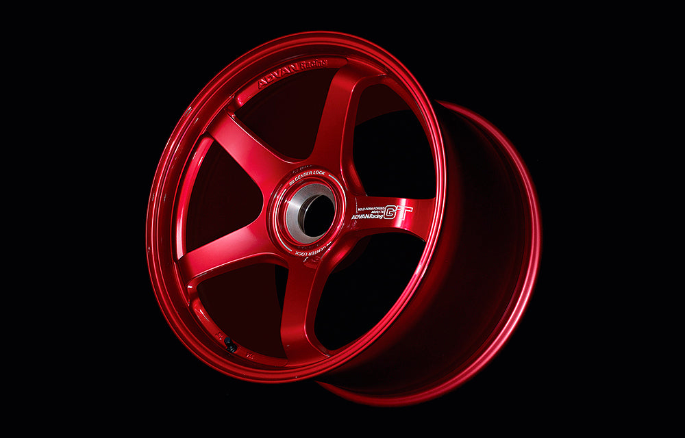 Advan GT for Porsche center lock wheel in Racing candy red in black background.