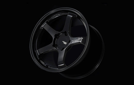 Advan GT for Porsche wheel in Racing Gloss Black in black background.