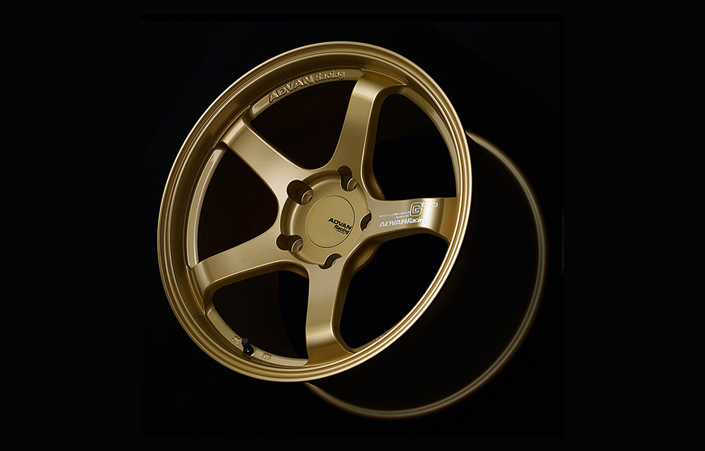 Advan GT for Porsche wheel in Racing bronze in black background.