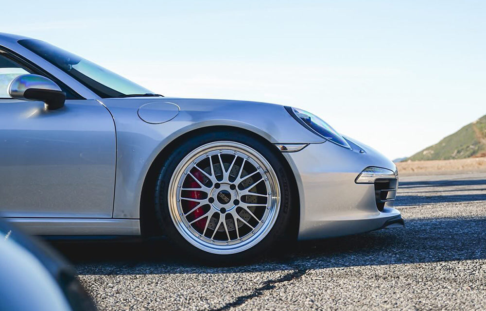 Close up of 20-inch BBS LM in Diamond Silver front wheel on a silver Porsche 991.1 at canyon road.
