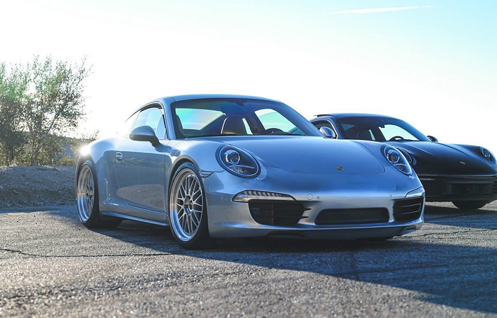 Silver Porsche 991.1 4S WB with 20-inch BBS LM in Diamond Silver parked at canyon road turnout.