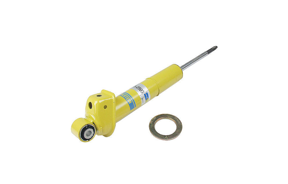 Yellow Bilstein shock absorber for Porsche on white background.