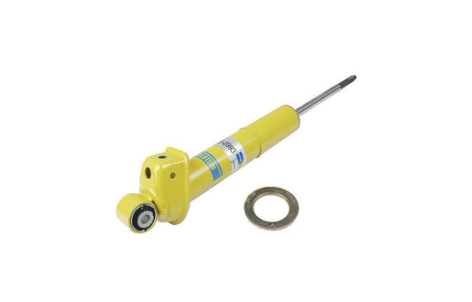 Yellow Bilstein shock absorber for Porsche on white background.