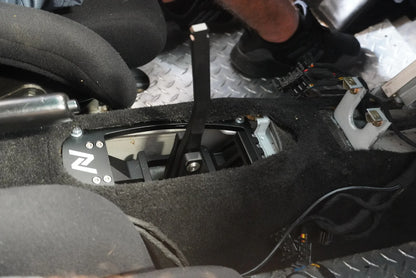 Numeric Short Throw Shifter component in black installed in center transmission tunnel of Porsche 911 race car.