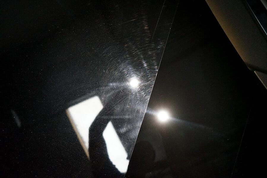 Porsche 911 black paint close-up before and after paint correction