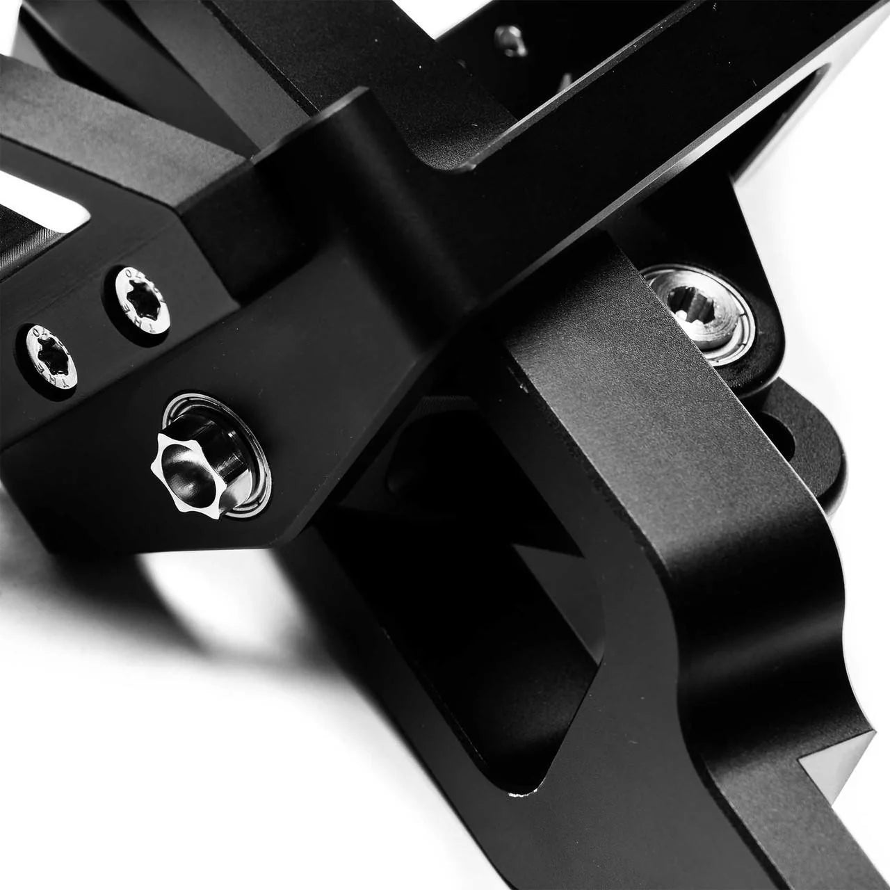 Close up of Numeric Short Throw Shifter component in black on a white background.