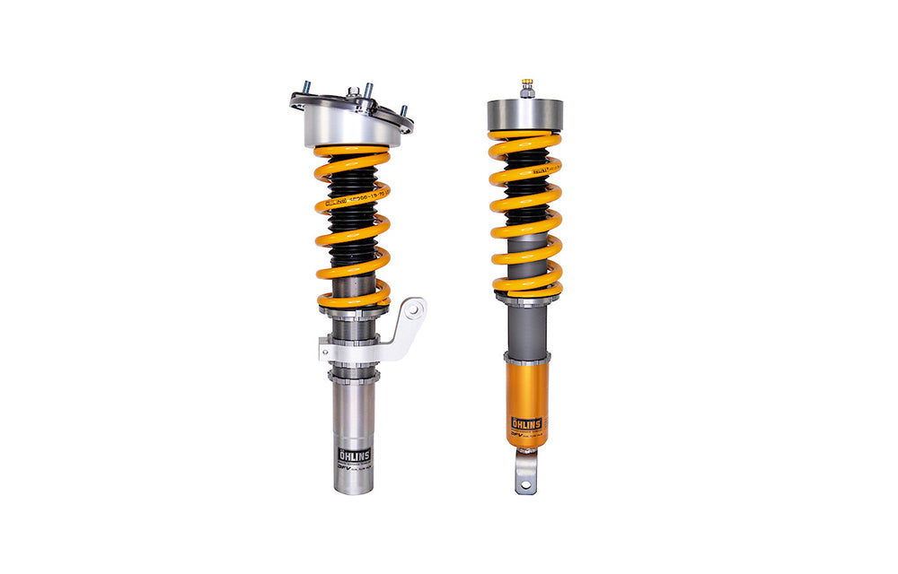 Two Ohlins Road And Track coilovers for Porsche on white background.