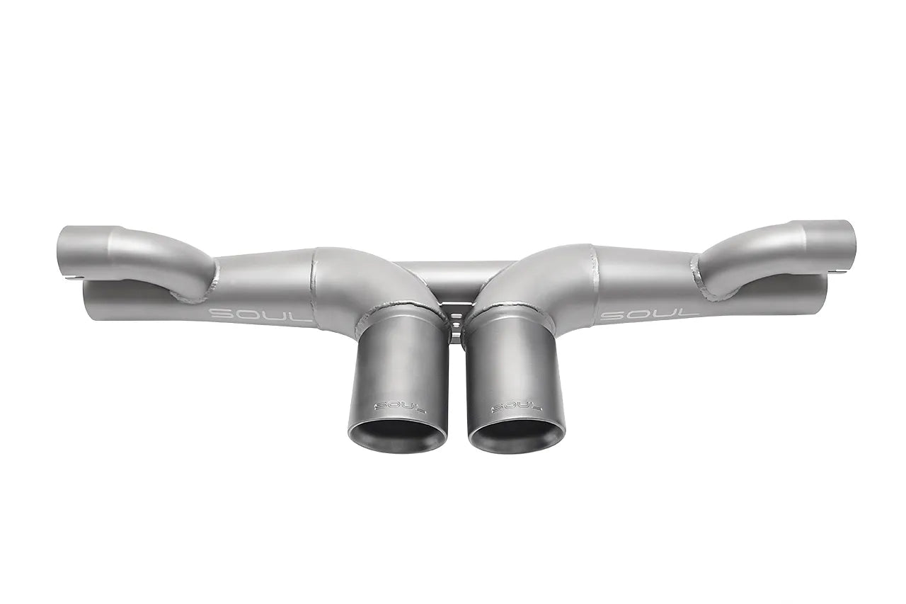 Soul Performance center muffler bypass exhaust system in silver for Porsche 911 GT3 on a white background.