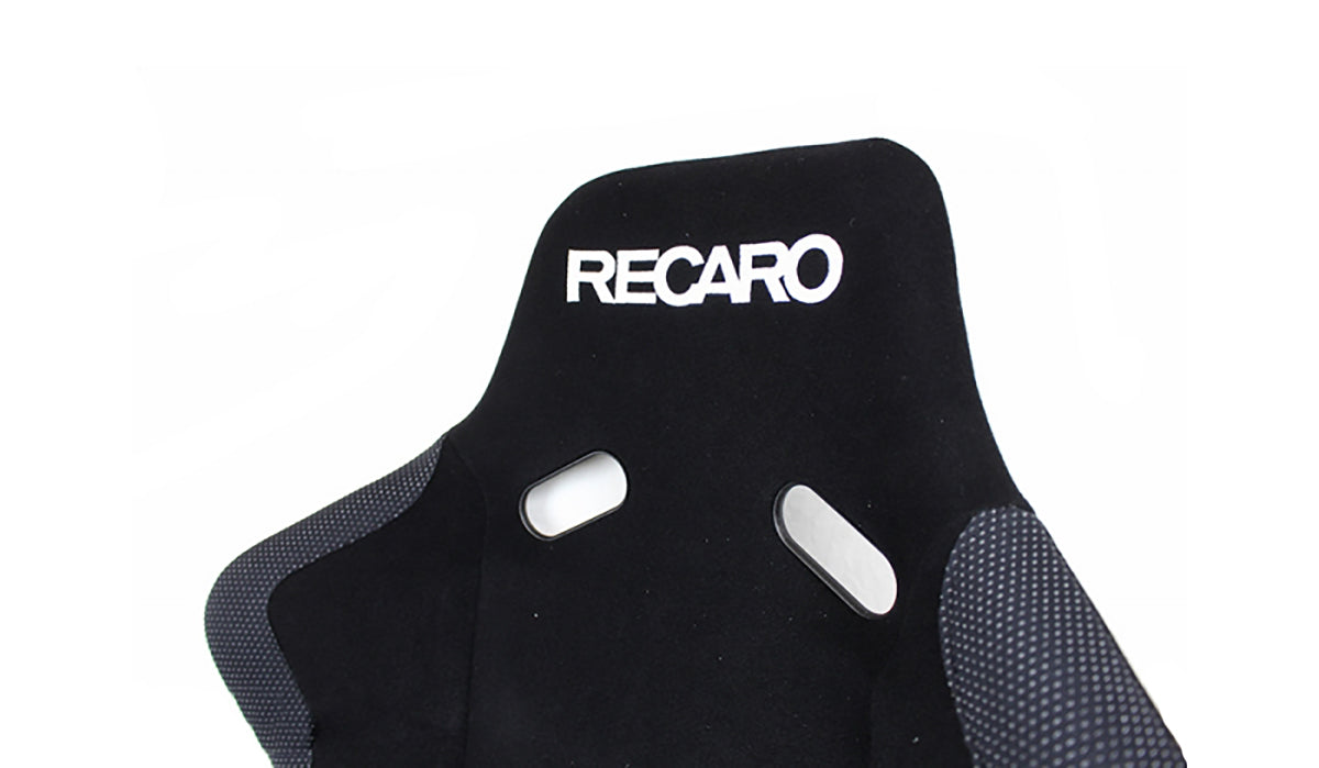 Close up of Recaro Pole Position black racing bucket seat with 'Recaro' branding on a white background.