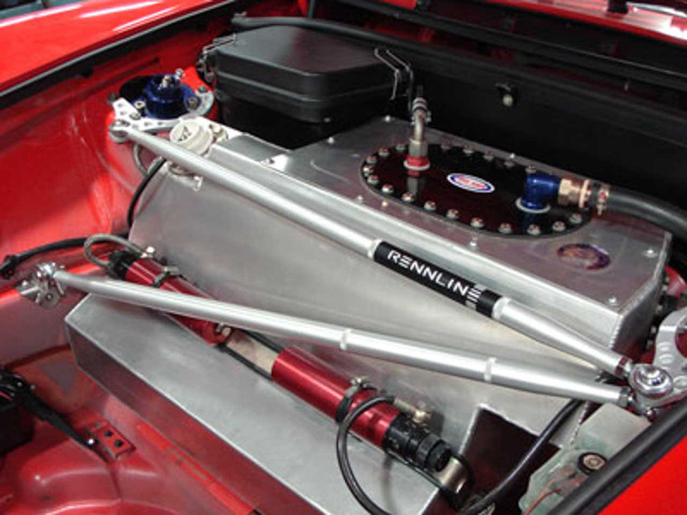 Rennline strut bar 3-point mount installed in a red Porsche bay.