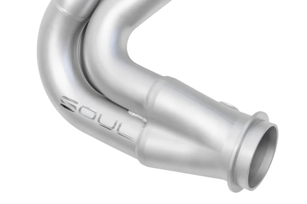 Close up of collector of Soul Performance street headers in silver for Porsche 911 GT3 on a white background.