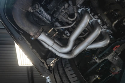 Close up of Soul Performance street headers in silver installed on engine of Porsche 911 GT3.