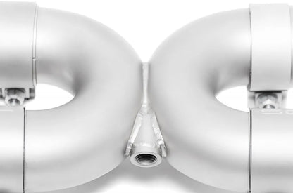 Close up of Soul Performance sport exhaust system X-pipe welds in silver for Porsche 993 on a white background.