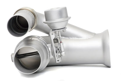 Close up of inlet and outlet Soul Performance side muffler bypass exhaust pipes in silver for Porsche 911 GT3 on a white background.