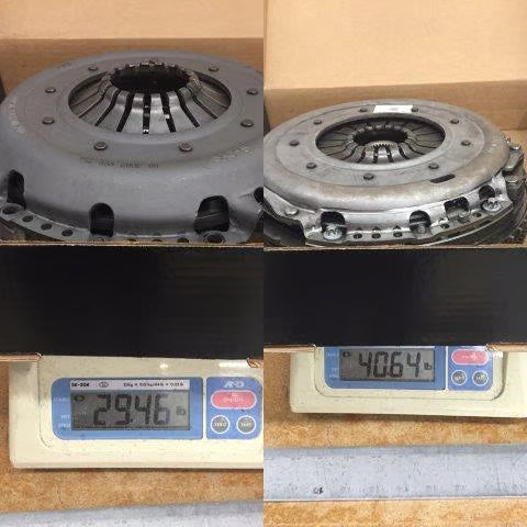 Two clutch discs on a digital scale with weight readings displayed for SharkWerks clutch compared against OEM factory clutch.
