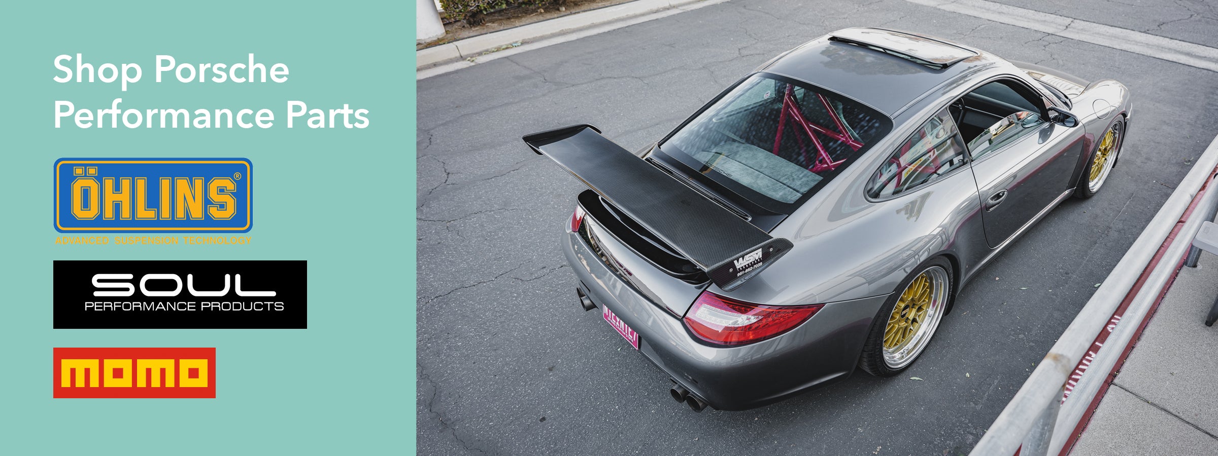 Gray Porsche 997.2 911 parked with promotional logos for Porsche performance parts and Ohlins, Soul, and Momo products.