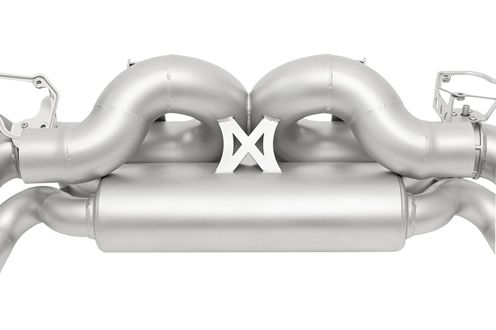 detail of Soul valved exhaust system for porsche 911 992 carrera on white background.