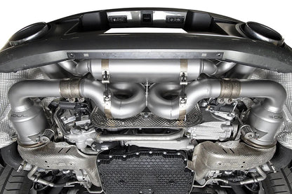 Underside view of Soul valved exhaust system installed on porsche 911 992 carrera.