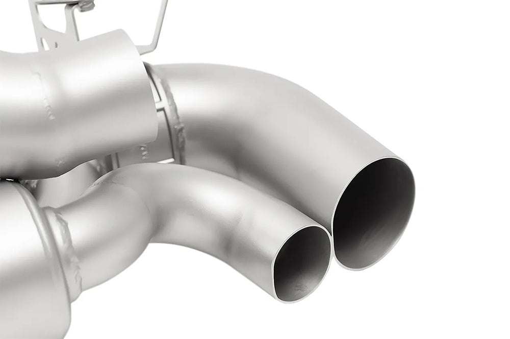close up of exhaust outlets on a Soul valved exhaust system for porsche 911 992 carrera on white background.