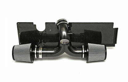 Fabspeed air intake system with carbon fiber heat shield for Porsche on a white background.
