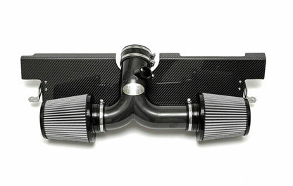 Fabspeed air intake system with carbon fiber finish for Porsche on a white background.