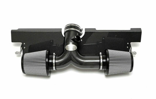 Fabspeed air intake system with carbon fiber finish for Porsche on a white background.