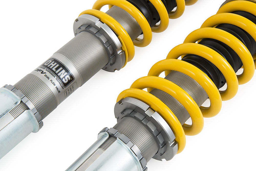 Close-up of Ohlins Road And Track coilover for Porsche with yellow coils on a white background