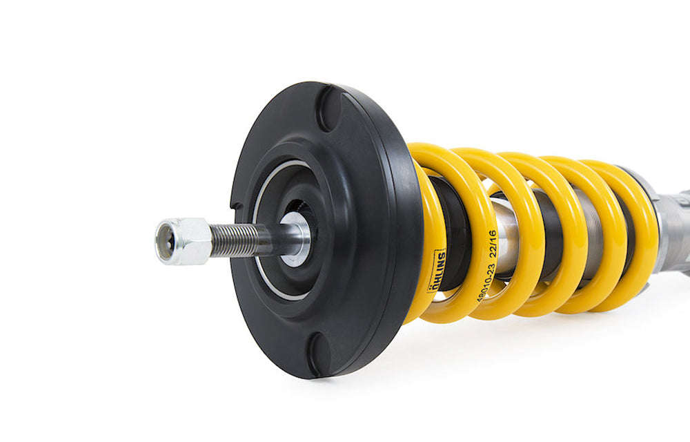 Close up of top hat for Ohlins Road And Track coilover for Porsche on white background.