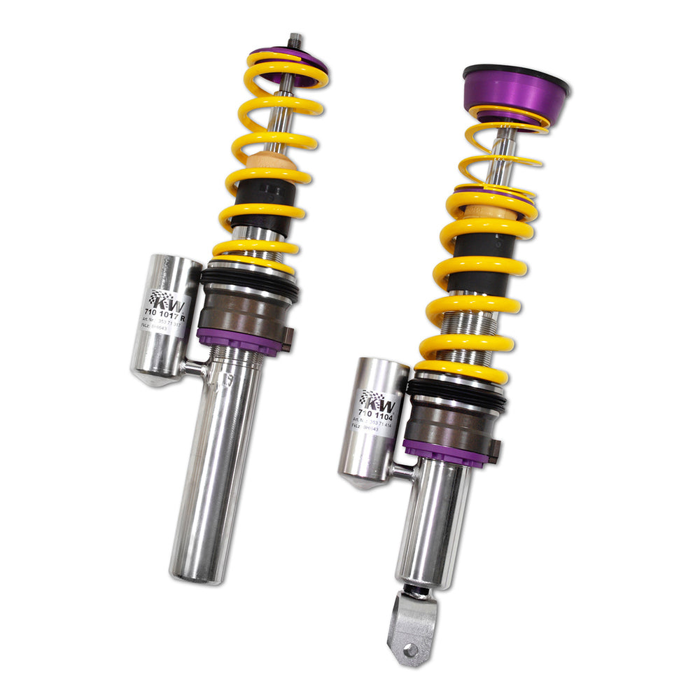 Two KW V3 coilovers with yellow springs and purple accents on a white background.