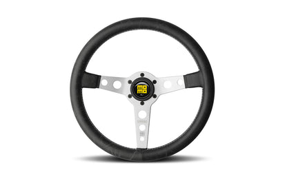 Momo heritage prototipo steering wheel  with silver center spokes in black in white background.