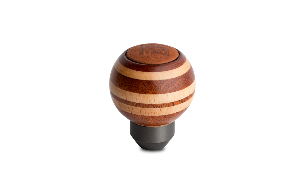 Momo Targa Heritage wooden shift knob with spherical design and leather top insert on transparent background.
