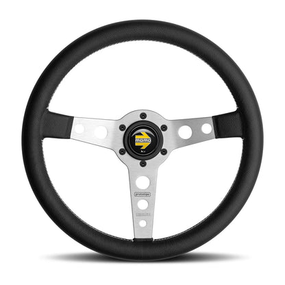 Momo Prototipo leather-wrapped steering wheel with silver spokes and Momo logo on horn button on a white background.