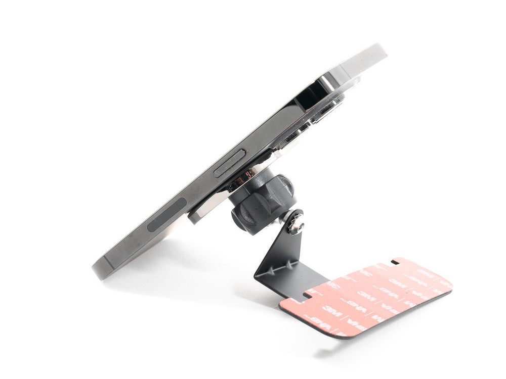 Rennline black magnetic car holder with adhesive strip on a white background.