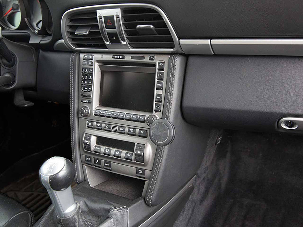 Porsche interior with a Rennline black magnetic car holder.