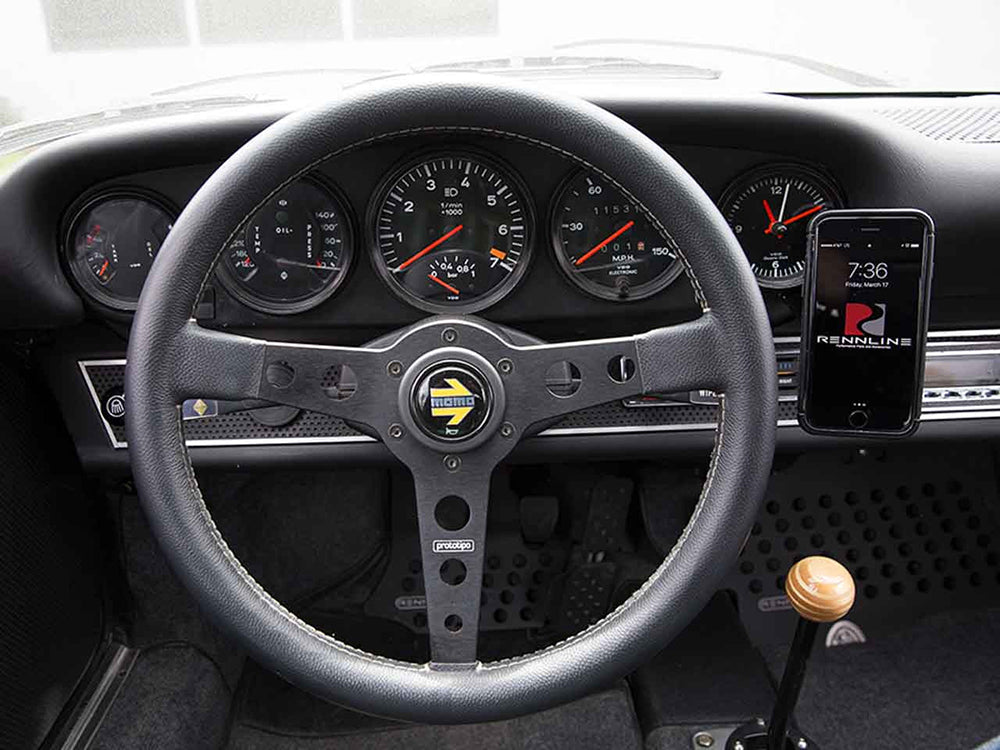 Porsche interior with Rennline magnetic phone mount installed.